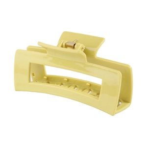 Macro detail of the matte yellow rectangular hair claw clip with strong metal spring