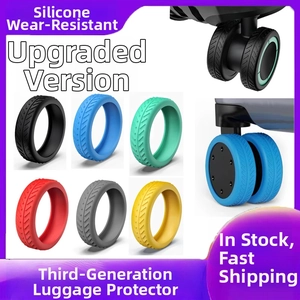 Close-up of silicone luggage wheel covers in multiple colors for noise reduction