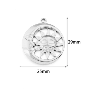 Macro detail of sun and moon face pendant showing 25mm x 29mm size and steel texture
