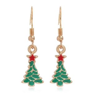 Close-up of gold Christmas tree earrings with green enamel and a red star detail