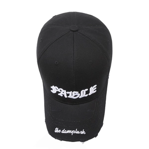Vintage distressed black baseball cap with white gothic letter embroidery and ripped brim