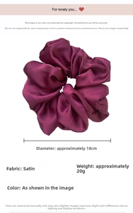 Detail view of large satin scrunchie in deep purple with 18cm diameter measurement
