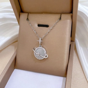 Silver celestial planet necklace with cat eye stone and cubic zirconia on gold silk