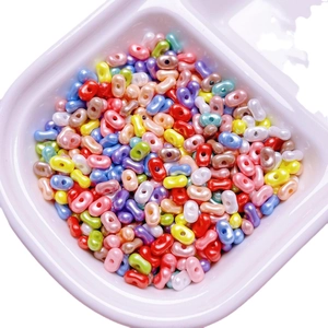 Colorful peanut shaped acrylic beads for DIY jewelry making in various pastel colors