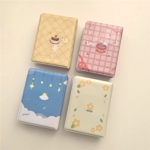 Four different colorful tin storage boxes for polaroid photos and idol collection cards