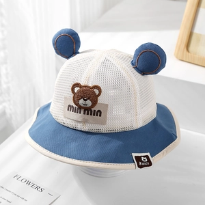 Detail of baby sun hat featuring breathable mesh crown and cute bear embroidery