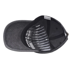 Detail view of the washed cotton baseball cap interior with white care label and inner seams