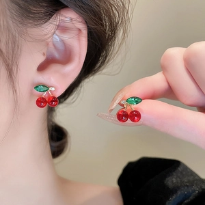 Cute cherry stud earrings with red glass beads and green crystal leaves in gold finish