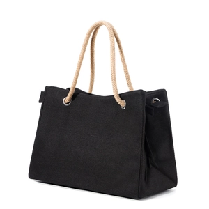 Chic black canvas straw tote bag with beige woven handles and silver metal eyelets