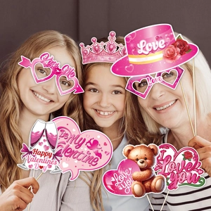 Valentine's Day party props set including heart glasses and pink festive photo booth signs