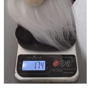 Detailed weight measurement showing the 174g handmade Halloween knitted gnome plush doll