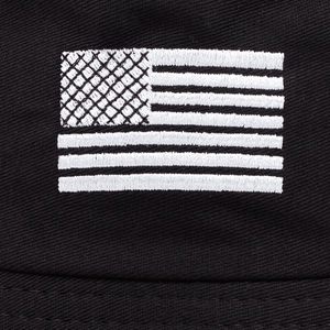 Close-up of US flag embroidery on black twill bucket hat with high density stitching