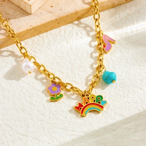 Golden stainless steel necklace featuring colorful rainbow and enamel flower charms