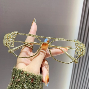 Chic gold metal double-bridge sunglasses with butterfly accent and sparkling rhinestones