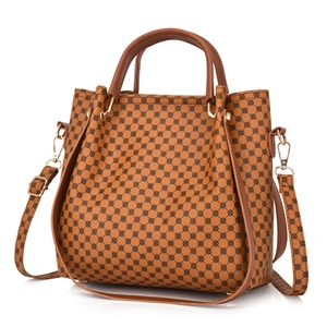 Vintage brown printed tote bag with dual handles and golden hardware on white background