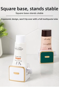 Close-up of manual rotating toothpaste squeezer with stable square base on tiled wall
