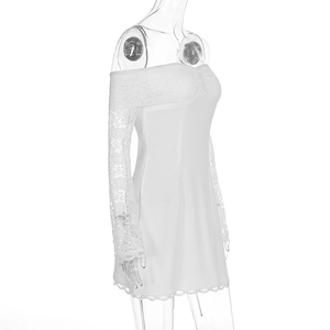 Detail of elegant off-shoulder white lace dress with sheer long sleeves and floral trim