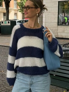Detail shot of navy and white striped chunky knit sweater with round neck and long sleeves