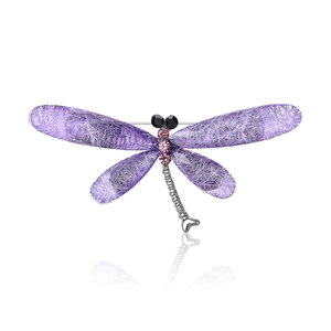 Creative dragonfly brooch with purple mesh wings and pink rhinestones on a white background