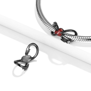 925 silver charm with red heart and winged dragon relief on a snake chain bracelet