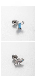 Detail view of screw-back titanium earrings featuring blue gems and colorful zircon stones