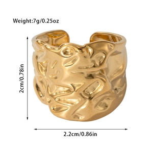 Detail view of gold titanium steel ring with hammered texture, 2cm height and 7g weight
