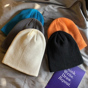 Winter warm knitted beanies in blue, grey, cream, orange and black for street style