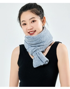 Close-up of the soft gray cashmere knitted scarf showing premium fabric texture and drape