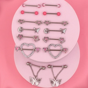 Pink series body piercing jewelry set featuring heart and butterfly nipple rings on a stand