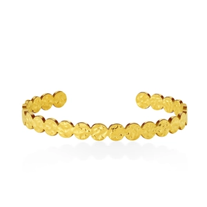 Detailed view of hammered golden open bangle featuring circular spliced texture and metal finish