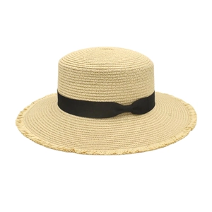 Flat top beige straw boater hat with black ribbon bow and frayed fringe edges