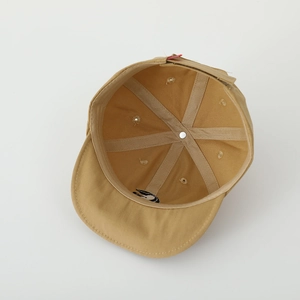 Interior view of khaki baby cap showing six-panel cotton construction and durable seams