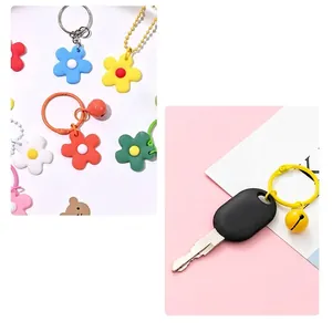 Colorful resin flower keychain with metal bell pendant for bags and car keys