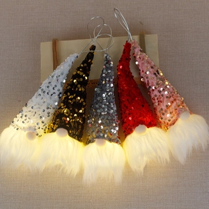 Five-piece LED light-up Christmas gnome hanging ornaments with sequin hats on wood