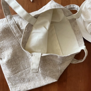 Internal view of cotton linen tote showing spacious interior and practical inner pocket