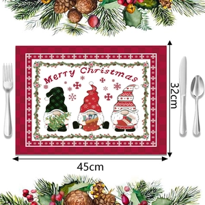 Detalle de mantel individual navideño de cuadros rojos con gnomos y felicitación