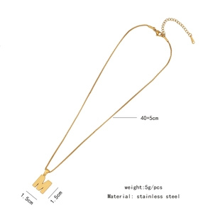 Detail of golden stainless steel M letter pendant necklace with 40+5cm chain size info