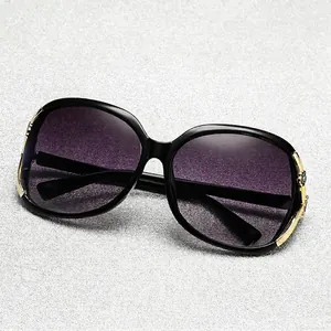 Women's polarized camellia sunglasses with oversized round frames and purple gradient lenses