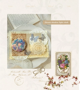 Detail of vintage scrapbooking kit with floral stickers and round anime badge on cream paper
