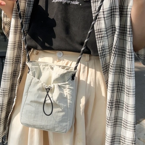 Off-white waterproof drawstring crossbody bag for yoga and running with cord strap