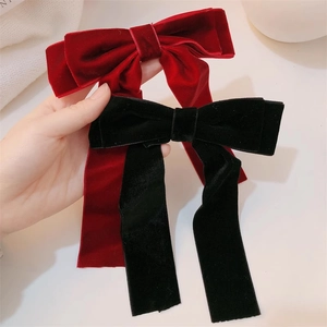 Elegant velvet bow hair clips in red and black with long streamers for women