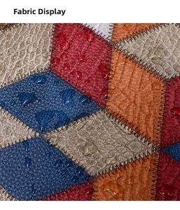 Detail of waterproof color-block leather fabric with lychee grain and contrast stitching