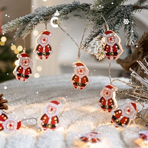 Christmas LED string lights with Santa Claus pendants emitting a warm yellow glow