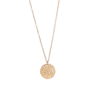 Macro detail of geometric hammered round pendant with polished chain in 18K gold finish