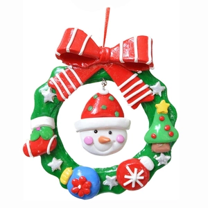 Christmas wreath ornament with snowman and red bow for festive holiday tree decoration