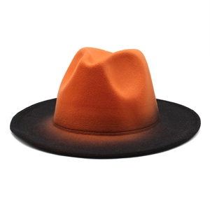 Detailed macro view of the gradient wool felt fedora showing orange to black transition