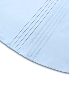 Macro detail of pleated hem on light blue linen shirt with double stitching