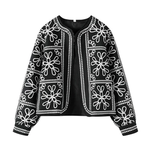 Women's autumn casual set featuring black floral embroidery jacket and shorts in a flat lay