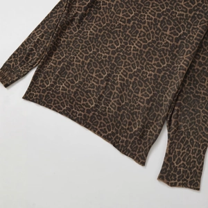 Women's crewneck knit top featuring a classic brown and black leopard animal print pattern