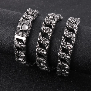 Three gothic silver stainless steel Cuban chain bracelets with skull charms for men